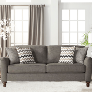 Max Ash couch from the Congaree collection with four accent pillows on a plush rug near a window